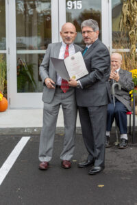 John Zarrella receiving certificate Mayor DiNatale